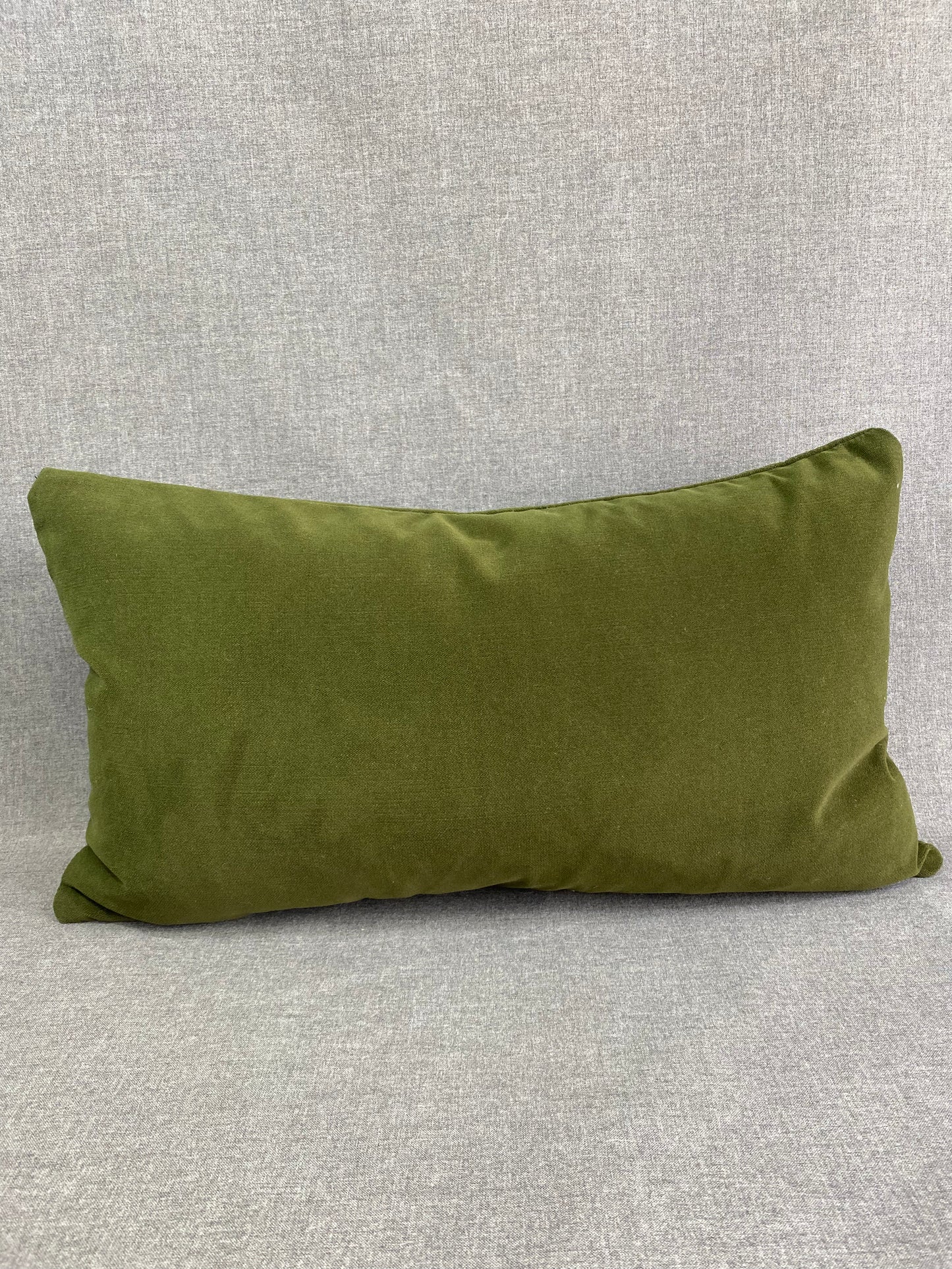 Belvedere Forest Lumbar; Jewel Green solid in a creamy smooth velvet fabric.