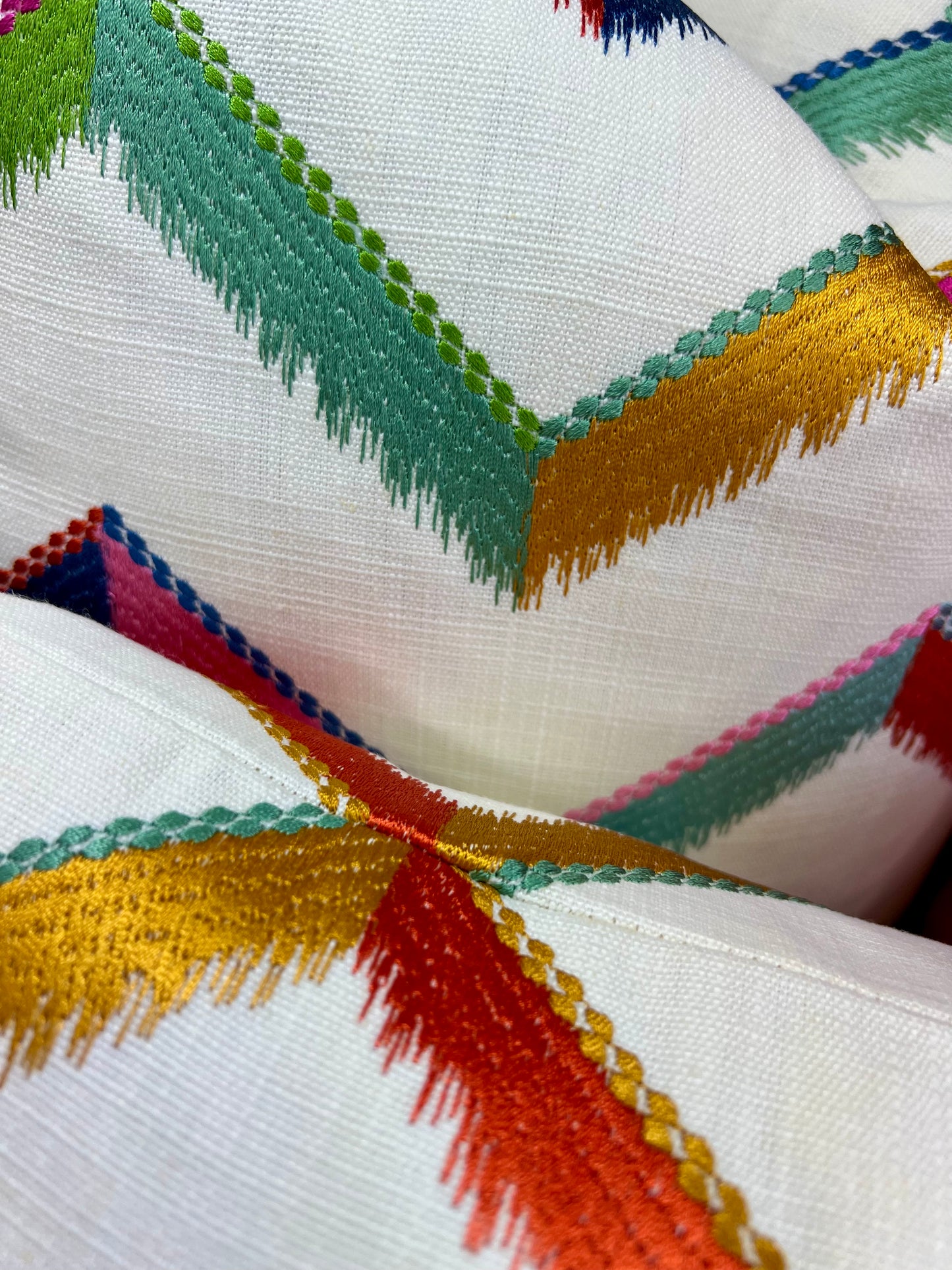 Luxury Lumbar Pillow - 24" x 14" - Chevron Confetti; Bright embroidered chevrons of pinks, greens blues, golds and oranges on a white linen textured background.