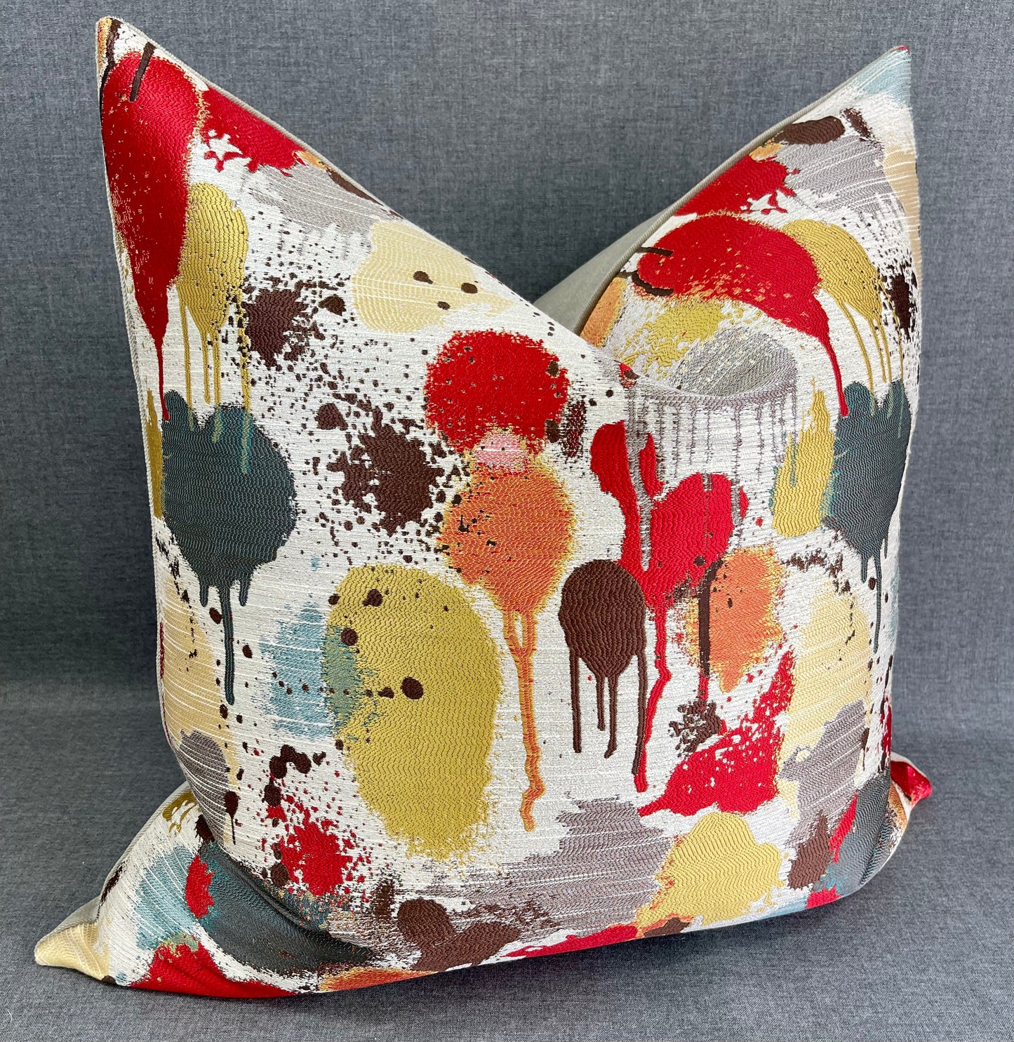 Luxury Pillow - 24” x 24” - Funfetti Red/Taupe; Bright red, green, teal, bronze and yellow spots on a cream background and with a cream back