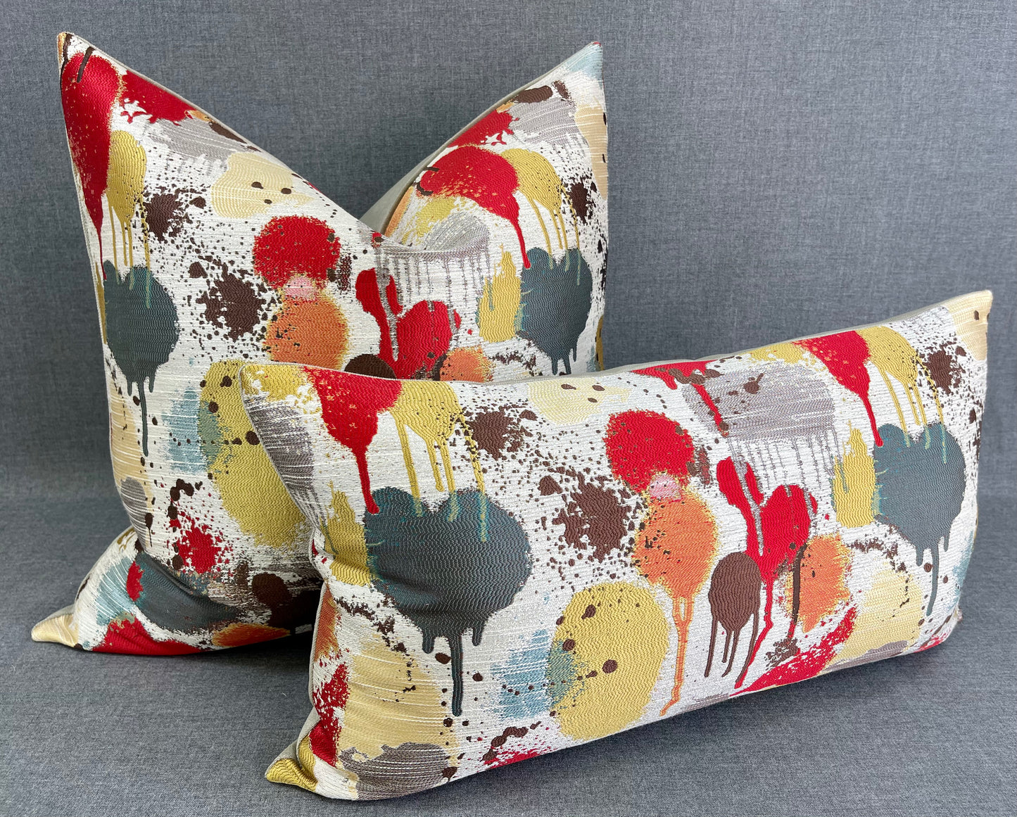 Luxury Pillow - 24” x 24” - Funfetti Red/Taupe; Bright red, green, teal, bronze and yellow spots on a cream background and with a cream back