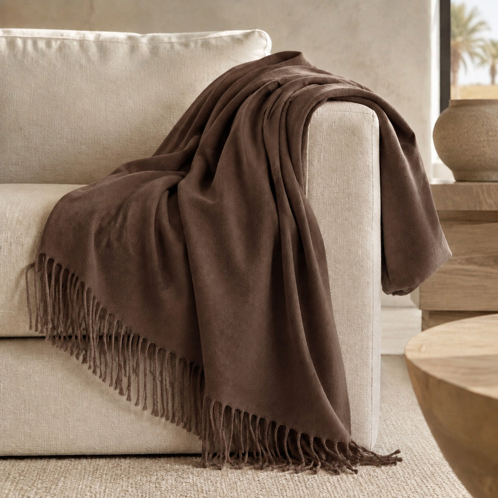 Edinburgh Hickory luxury throw styled on a neutral sofa
