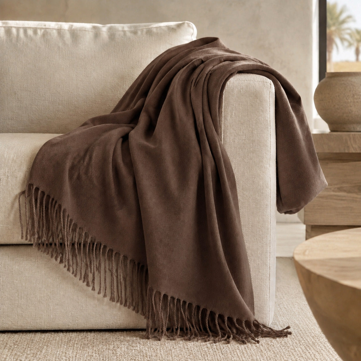 Edinburgh Hickory luxury throw styled on a neutral sofa