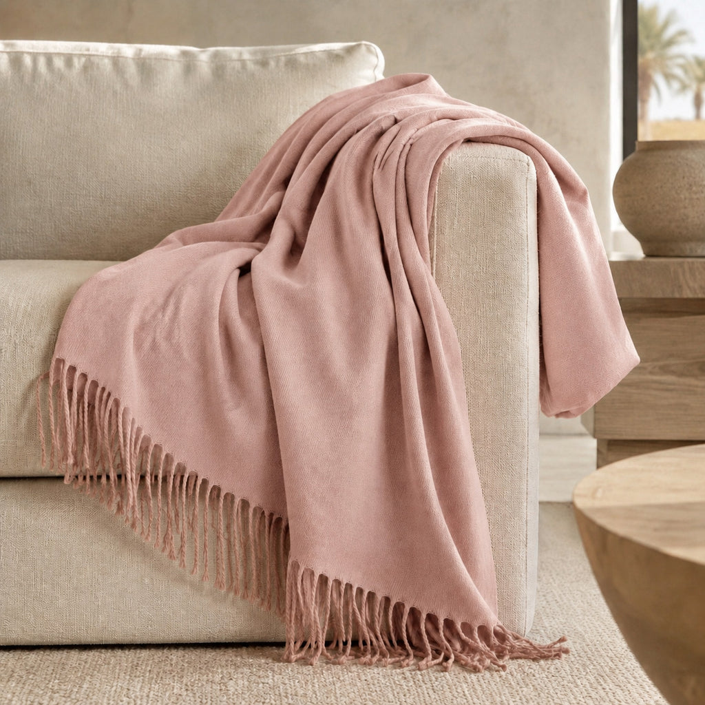 Edinburgh Pink Sand luxury throw styled on a neutral sofa