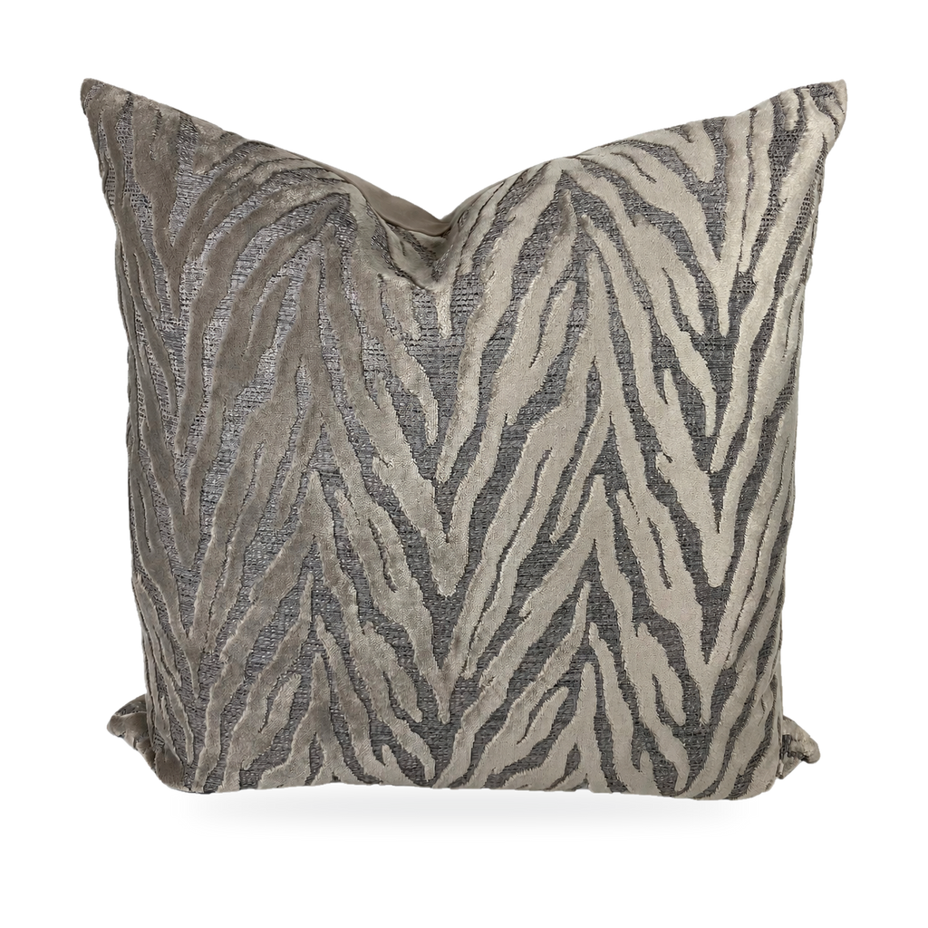 Decorative pillow with zebra pattern on a plain background
