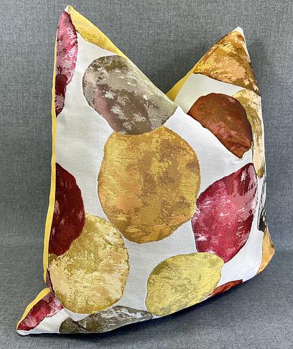 Luxury Pillow -  24" x 24" - Balloons: A fun pattern of red, yellow, orange and chartreuse circles on an ivory background