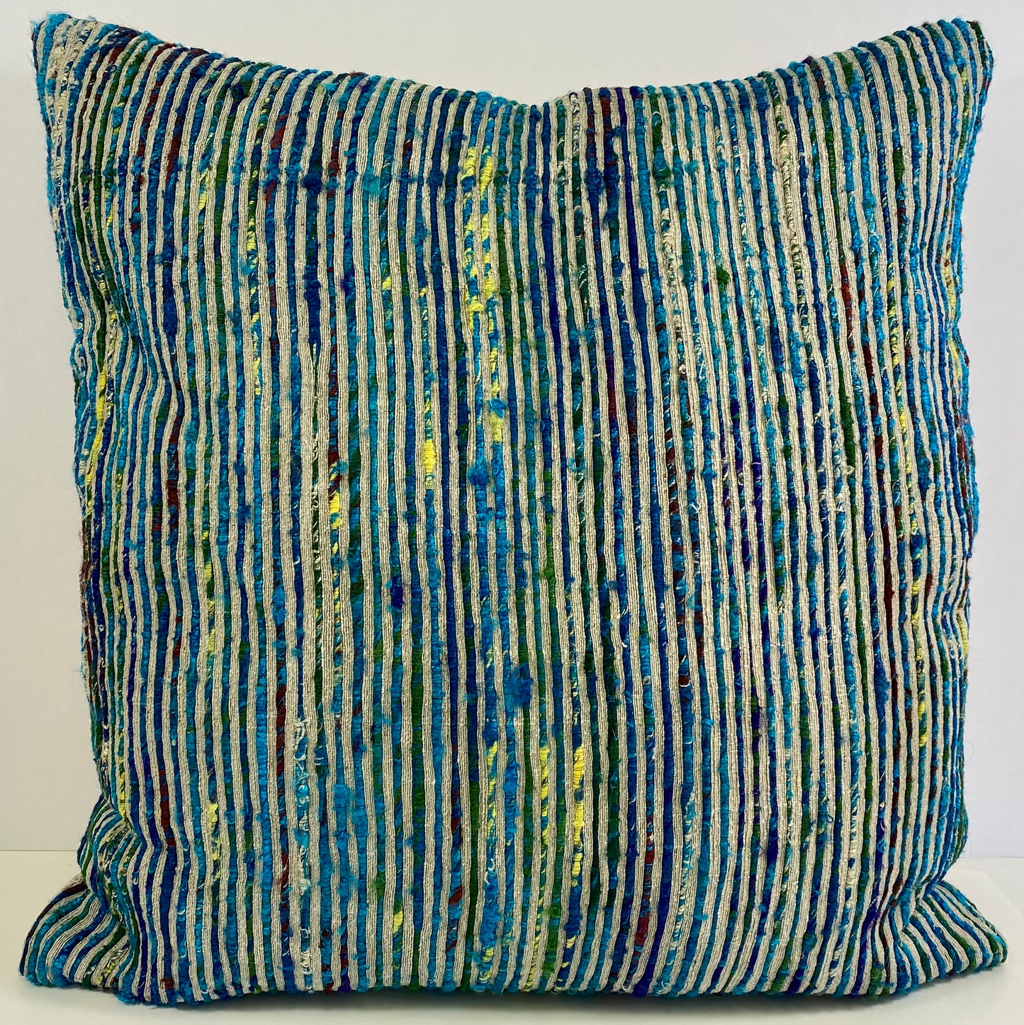 Luxury Pillow 22"; Color Twist-Blue, twisted strands of blues and yellow against a tan background