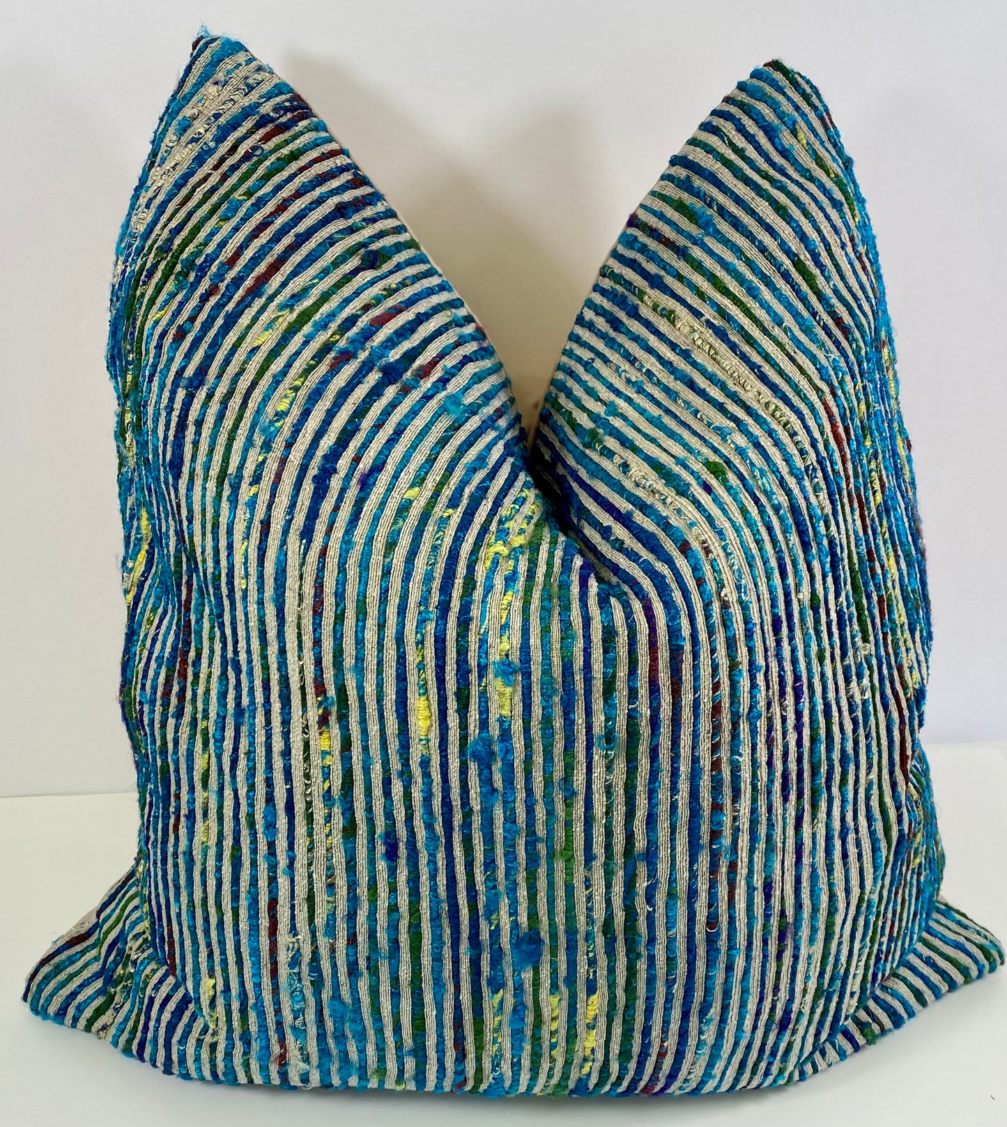 Luxury Pillow 22"; Color Twist-Blue, twisted strands of blues and yellow against a tan background